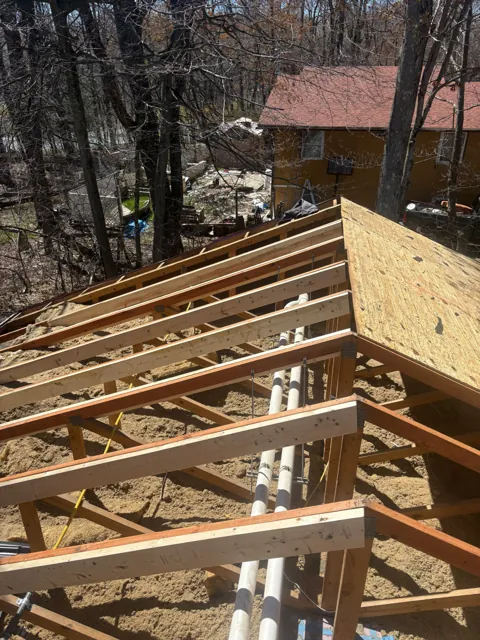 Roof rafters and plywood sheathing during installation