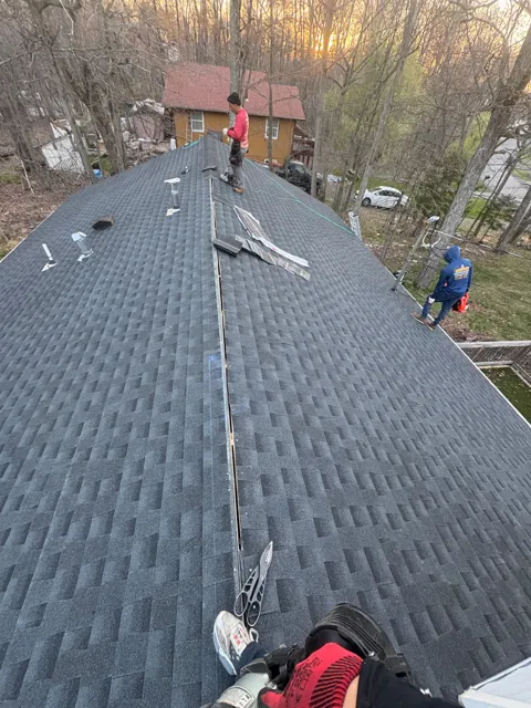 Roof shingle installation along the ridge