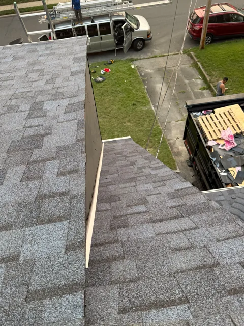 Finished shingle roof edge and gutter detail